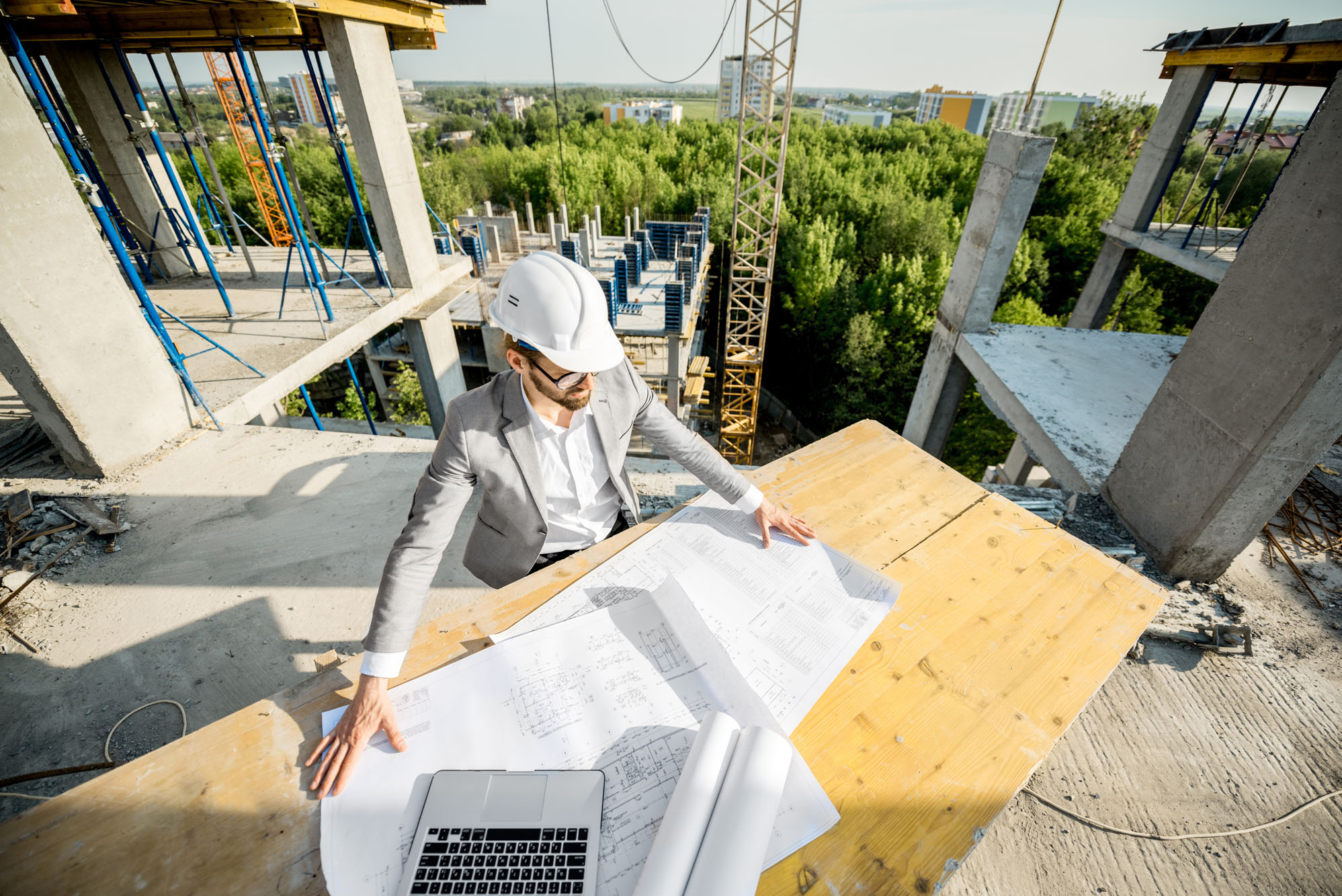 Engineer with drawings on the structure